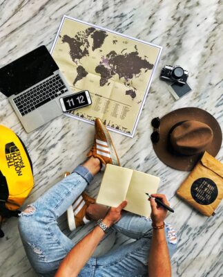 person in blue denim jeans and yellow shirt sitting on yellow chair
